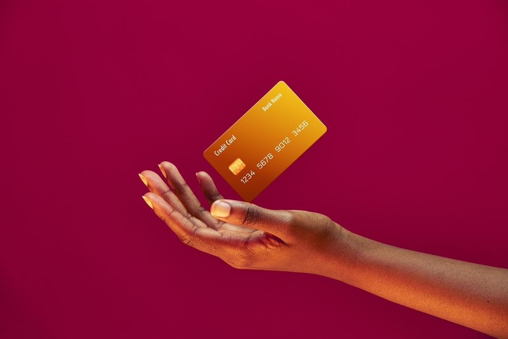 African,American,Female,Hand,And,Levitating,Template,Bank,Credit,Card